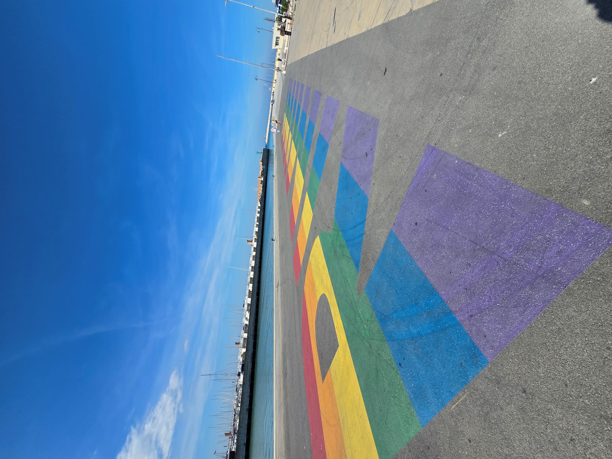 Rainbow pride artwork painted on the Rimini harbour front